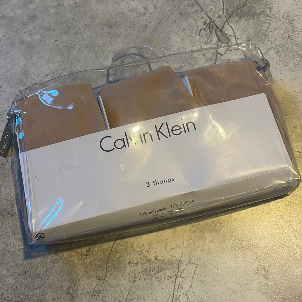 Calvin Klein woman’s thong 3 pack NIP size Med Comes with a zipper close bag.